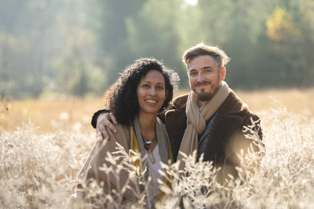istock A romantic walk of lovers on the grass. 1463263497