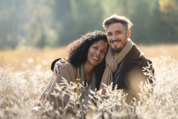 istock A romantic walk of lovers on the grass. 1463263501