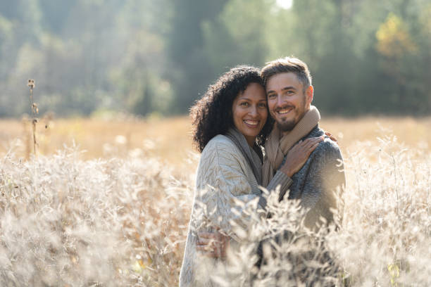istock A romantic walk of lovers on the grass. 1463263520