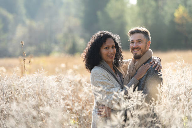 istock A romantic walk of lovers on the grass. 1463263529