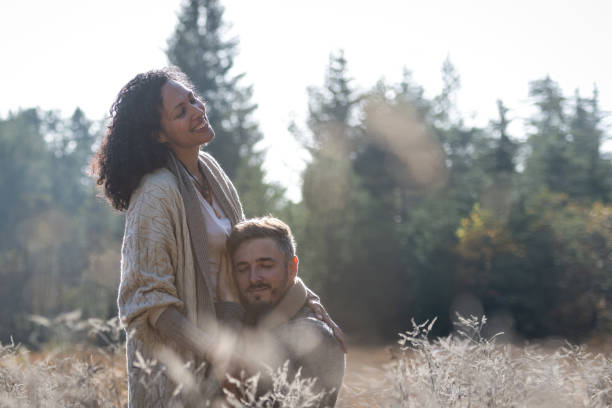 istock A romantic walk of lovers on the grass. 1463263537