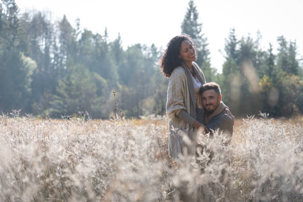 istock A romantic walk of lovers on the grass. 1463263545