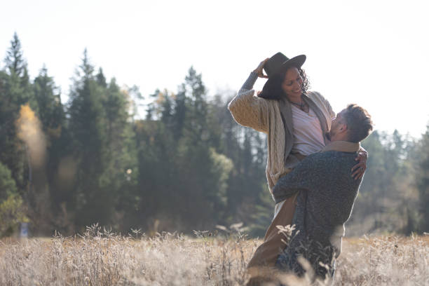 istock A romantic walk of lovers on the grass. 1463263566