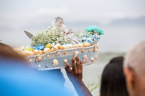 boat with offerings to iemanja, during a party at copacabana beach in Brazil. boat with offerings to iemanja, during a party at copacabana beach. spiritualy stock pictures, royalty-free photos & images