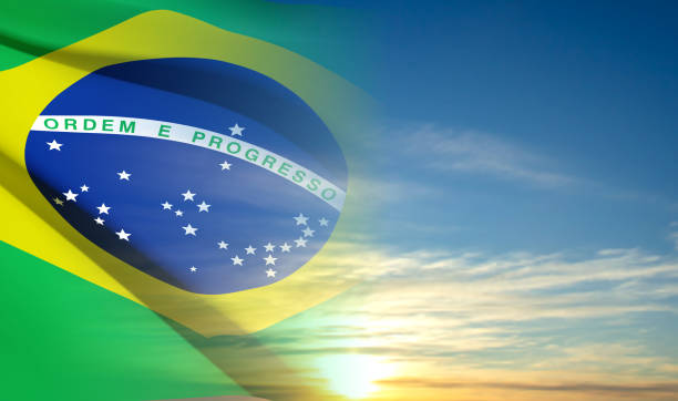 istock Flag of Brazil on background of sky 1463279377