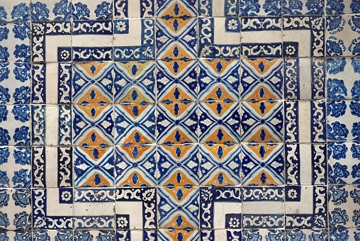 The walls of historic buildings in Mexico City are covered in decorative ceramic tiles.