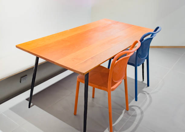 istock A simple wooden desk and two plastic chairs 1463281745