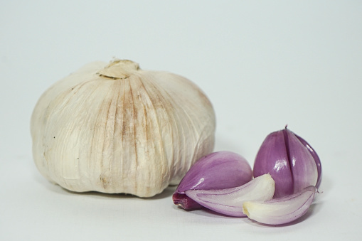 Raw whole garlic isolated on white background. Full depth of field