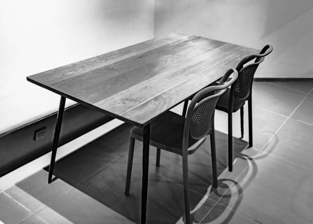istock A simple wooden desk and two plastic chairs 1463283180