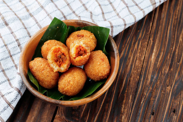 Combro Oncom dijero, Sundanese Fritter Combro Oncom dijero, Sundanese Fritter Made from Grated Cassava Stuffed with Spicy Oncom Fermented Soybean gorengan stock pictures, royalty-free photos & images