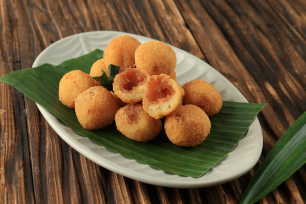 Misro Amis di Jero, Grated Cassava with Palm Sugar Sweet Filling Misro Amis di Jero, Grated Cassava with Palm Sugar Sweet Filling, Typical Food from West Java gorengan stock pictures, royalty-free photos & images