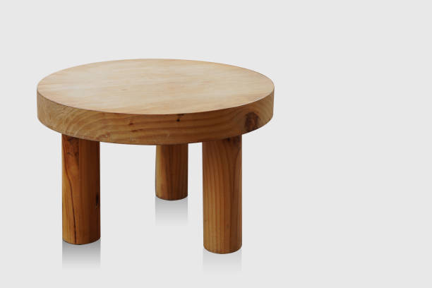 istock old brown round wooden table with three legs on white background, object, decor, banner, template, copy space 1463293042
