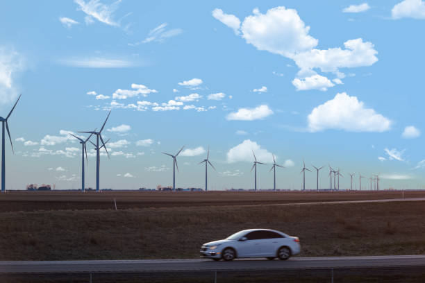 istock Wind turbines farm and highway road 1463294802