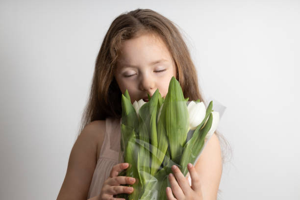 istock Little girl with flowers 1463296751