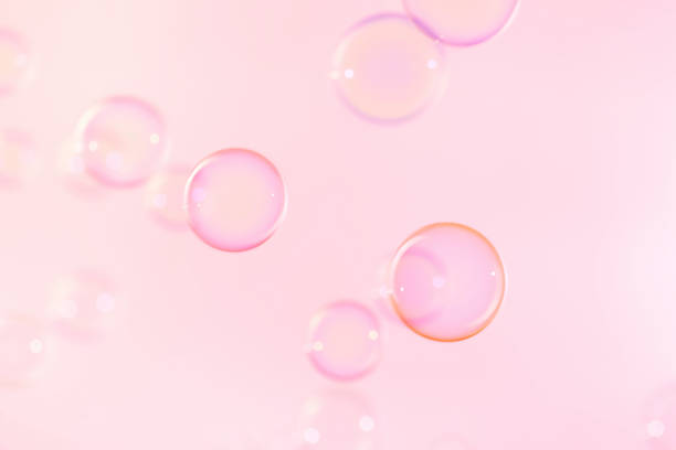 istock Beautiful Pink Soap Bubbles Abstract Background. Soap Sud Bubbles Water 1463309767