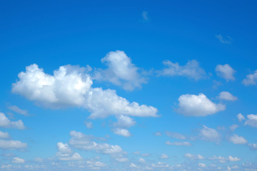 Background image of sunny blue sky with white clouds