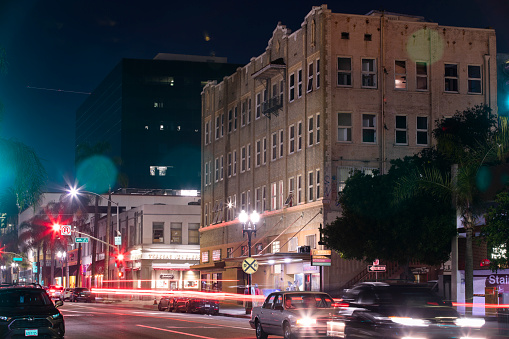 Santa Ana, California, USA - February 4, 2023: A historic lamp illuminates historic downtown Santa Ana.