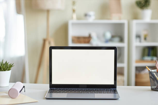 istock Background open laptop with blank white screen mockup on students desk 1463319565