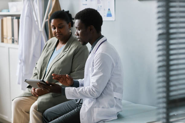 istock Doctor patient talking in clinic 1463319933