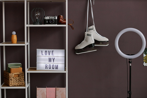 Background image of teenagers room interior with Love my room sign and hobbie items on wall, copy space