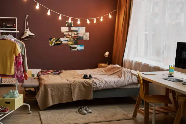 Background image of teenagers room with lights and pictures on wall, copy space