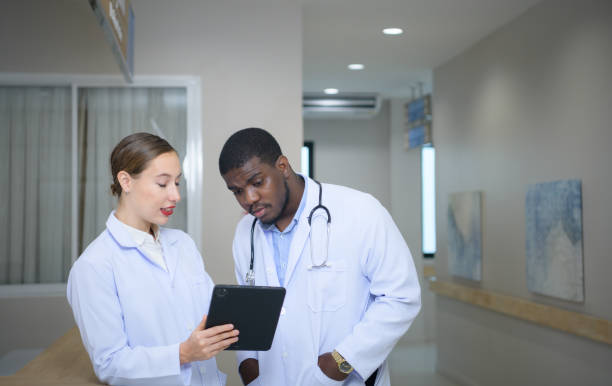 istock Both of doctors are analyzing the patient's MRI results on tablet to share ideas and discover new information for the patient's benefit in their treatment. 1463321780