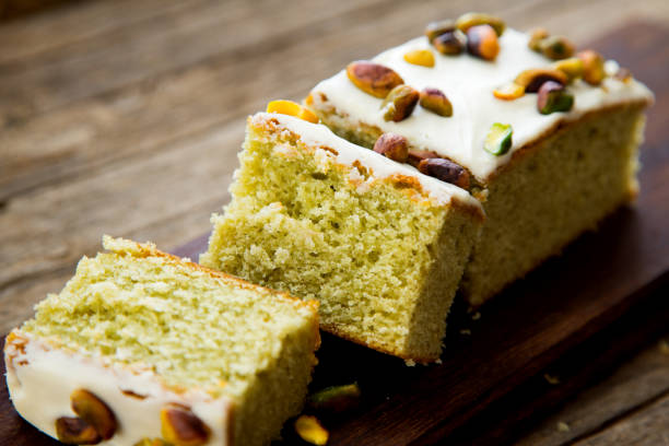 istock Pistachio sponge cake covered in icing sugar. 1463327614