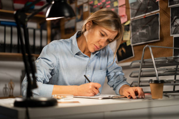 istock Detective working at desk in her office. 1463330581