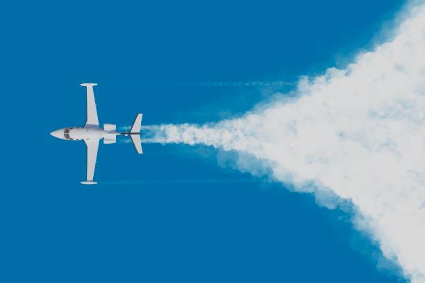 Aircraft In The Sky with trails