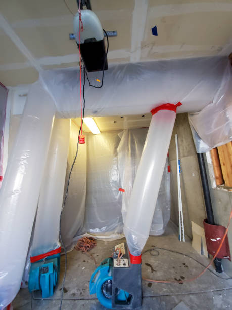 istock Water Restoration Equipment drying out a ceiling after a water loss 1463339408