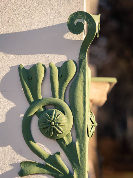 istock green metallic decoration element on white wall of old building 1463341715