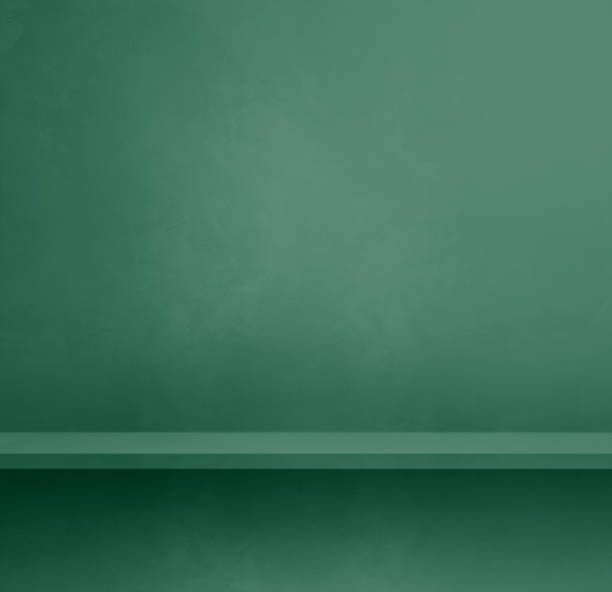 istock Empty shelf on a dark green concrete wall. Background template. Square mockup 1463342467