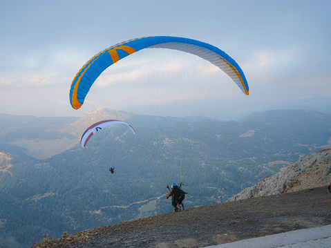 Paraglider over mountains