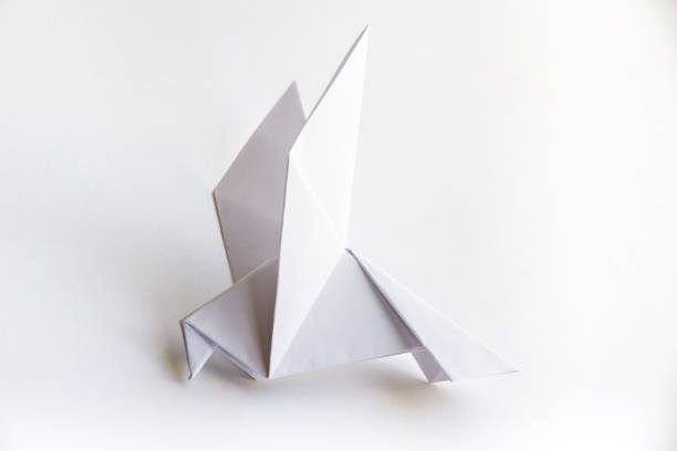 istock Paper dove origami isolated on a white background 1463343238