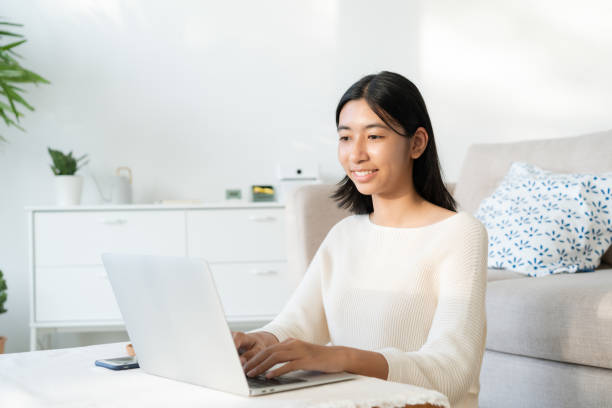 istock Asian woman typing work with laptop homework 1463344109