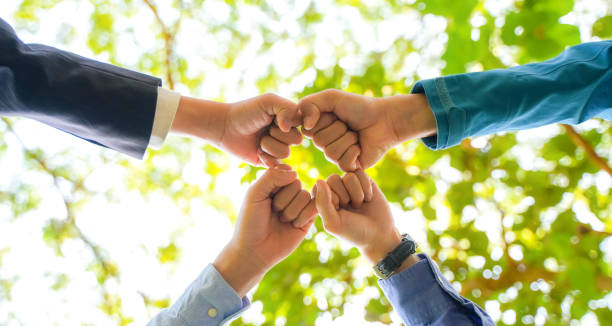 istock World environment day Global community teamwork, CSR and ESG environmental energy saving partnerships work together for the Sustainable Development Goals. People join for cooperation success. 1463344343
