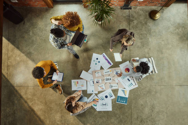 istock Above view of creative team working at casual office. 1463345131