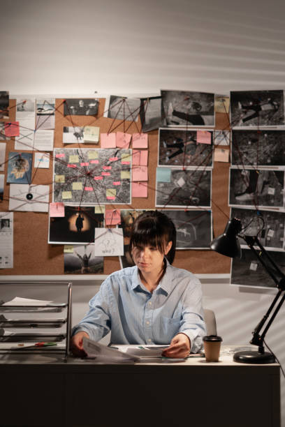 istock Detective working at desk in her office 1463346401