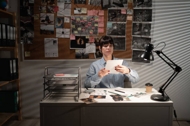 istock Detective working at desk in her office 1463346916