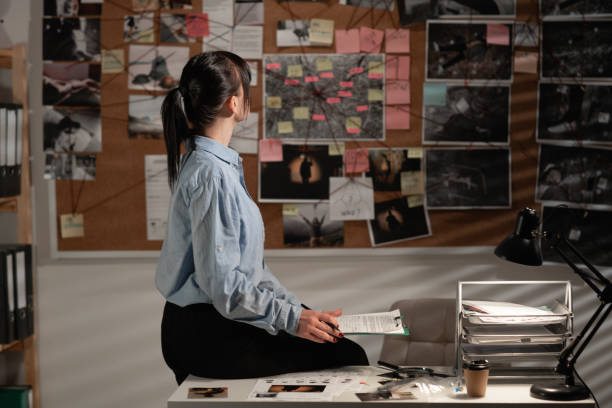 istock female detective looking at evidence board in her office 1463346922
