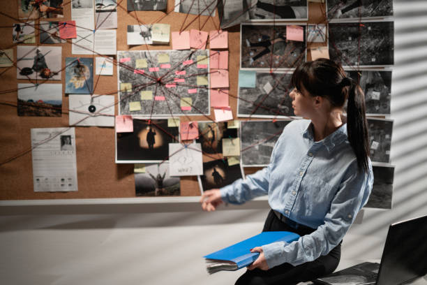 istock Criminal investigator analyzing case details in office, inquiry 1463346987