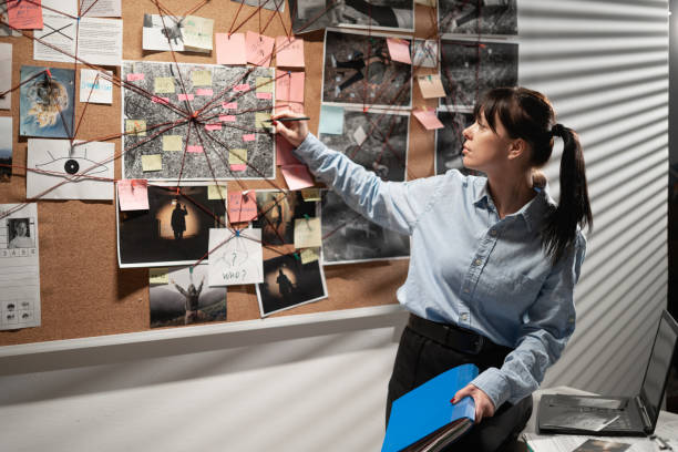 istock Secret agent searching for criminal movements on investigation board 1463346990