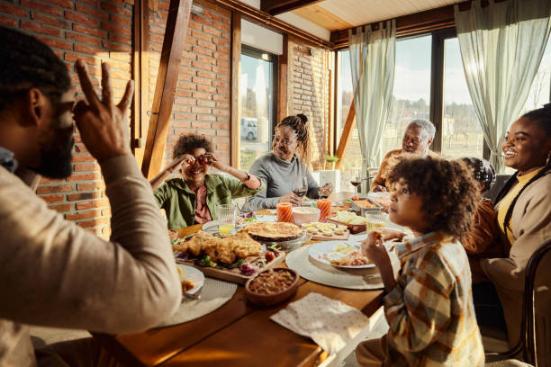 istock Happy black extended family having lunch at dining table. 1463347505