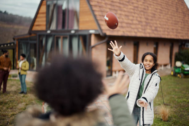 istock Playing with rugby ball in the backyard! 1463348009