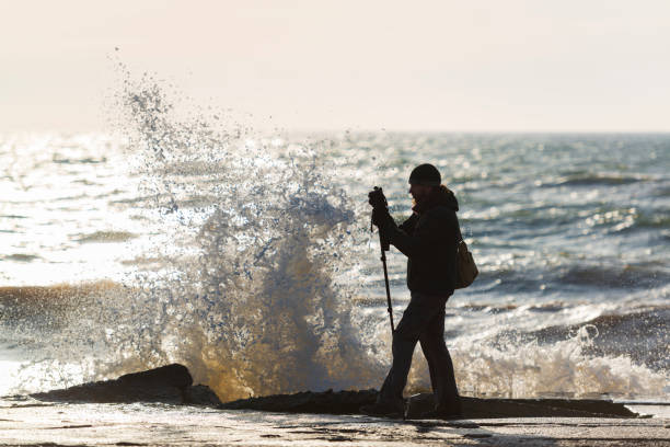 istock Photographer silhouette at the seaside. 1463348100