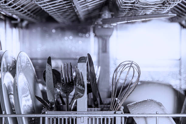 istock Open dishwasher with clean utensil inside, cutlery, glasses, dishes at kitchen 1463348169