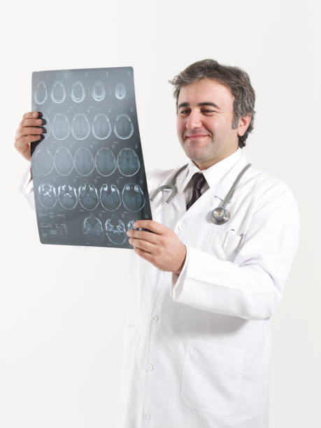 istock Doctor looks at brain scan images 1463349423