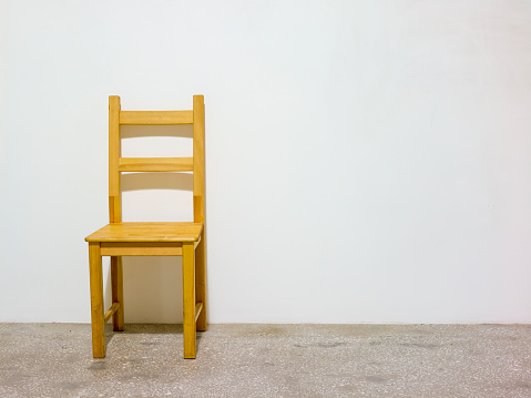Wooden chair in an empty room