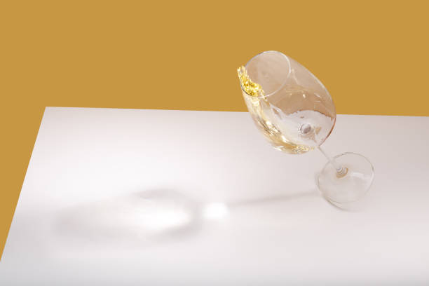 istock A glass of white wine is on the table. Light background. 1463357481