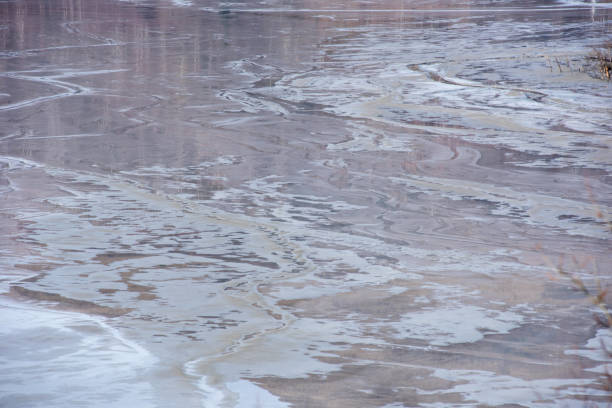 muddy waters in a decantation pond. toxic residuals from a copper mine decanting in a settling basin - underwater mine imagens e fotografias de stock